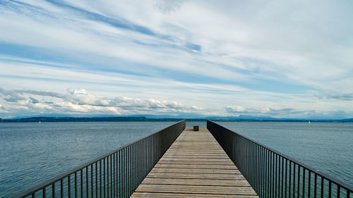 Pier over sea against sky