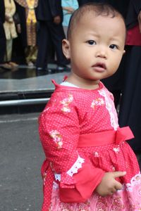 Close-up of cute girl standing outdoors