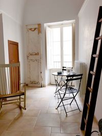 Empty chairs and table at home, mediterranean  interior