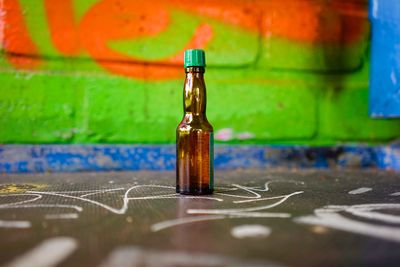 Close-up of glass bottle on table