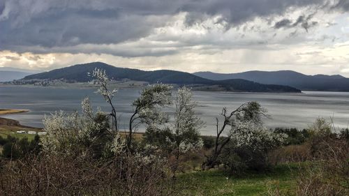 View of lake against cloudy sky