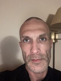 Close-up portrait of man at home