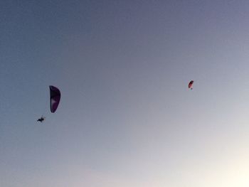 Low angle view of kite flying against clear sky