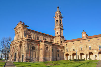 Low angle view of historic building against clear blue sky