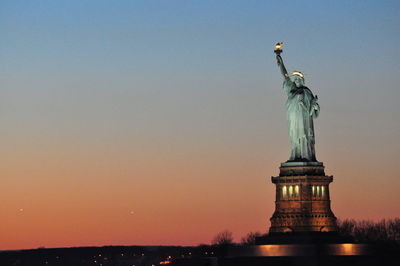 Statue of liberty at sunset