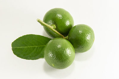 Close-up of fruits against white background