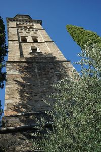 Low angle view of built structure against blue sky