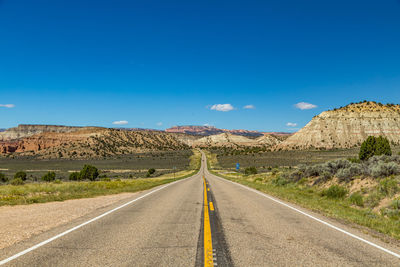 Empty road towards canyon