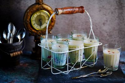 Close-up of wine glasses on table