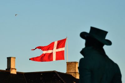 Low angle view of flag against clear sky