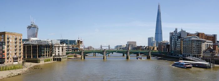Bridge over river with buildings in background