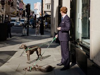 Man with dog in city