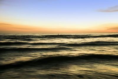 Scenic view of sea at sunset