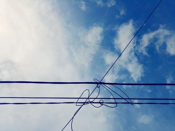 Low angle view of electricity pylon against sky