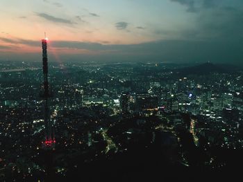 Aerial view of city lit up at night