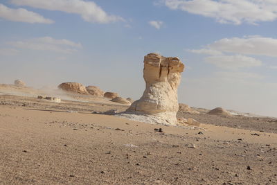 Rock formations in desert against sky