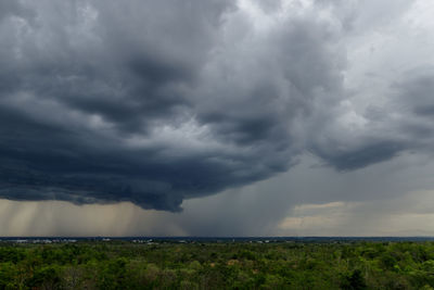 Scenic view of storm clouds over landscape