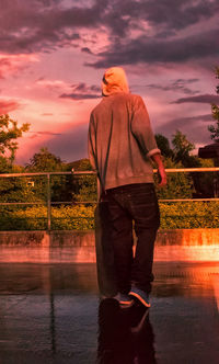 Woman standing against sky
