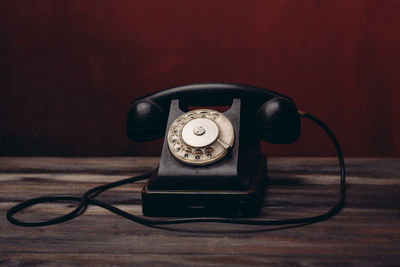 Close-up of vintage telephone on table