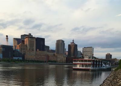 Cityscape against cloudy sky