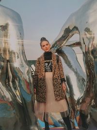 Portrait of young woman standing outdoors