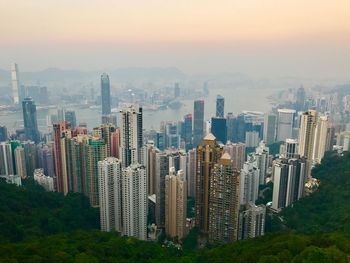 Aerial view of modern buildings in city against sky