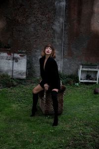  young woman sitting on armchair