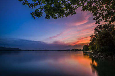 Scenic view of lake against sky during sunset