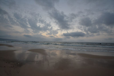 Scenic view of sea against cloudy sky