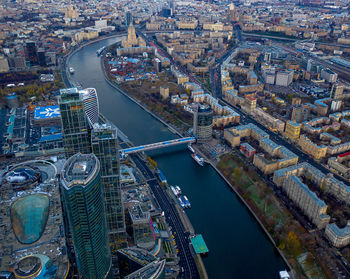 High angle view of bridge over river and buildings in city