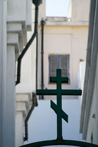 Low angle view of cross on building