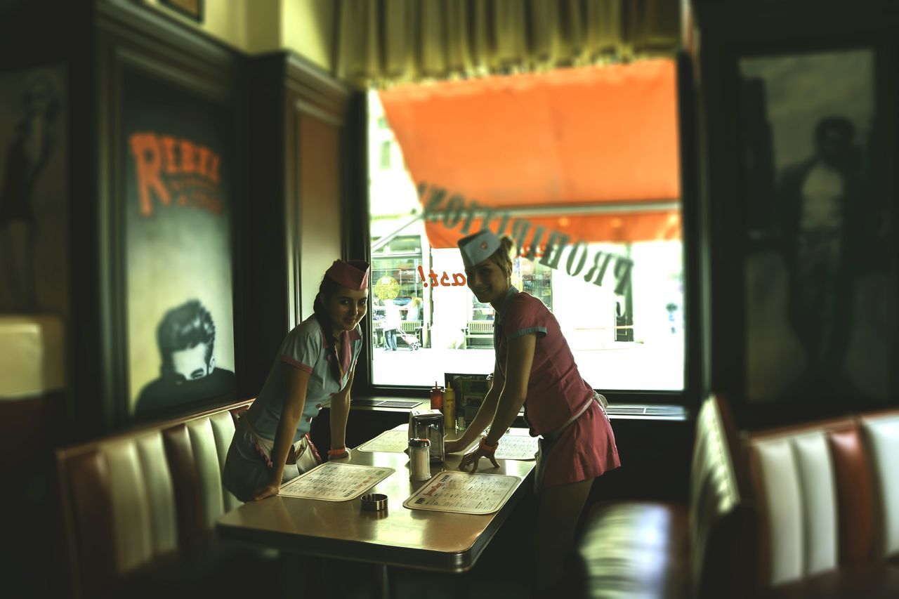 indoors, table, communication, selective focus, home interior, book, focus on foreground, desk, still life, chair, restaurant, one person, close-up, technology, paper, text, wireless technology, absence, western script, education