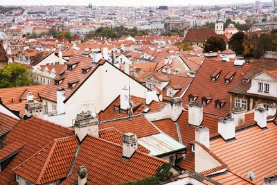 High angle view of houses in town against sky