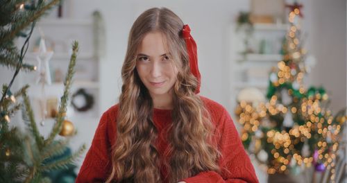 Portrait of smiling young woman looking away