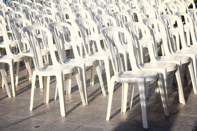 High angle view of empty chairs arranged on street