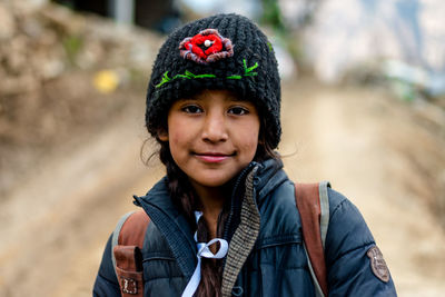 Portrait of smiling woman wearing hat