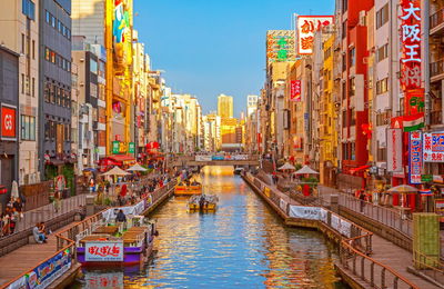 Canal amidst buildings in city