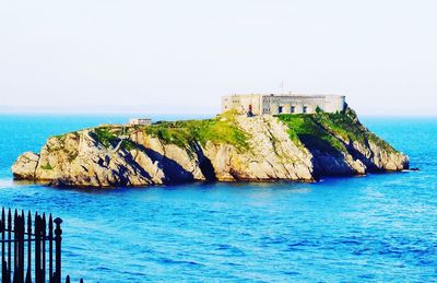 Scenic view of calm sea against clear sky