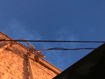 Low angle view of building against blue sky