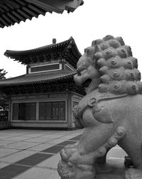 Low angle view of statue against building