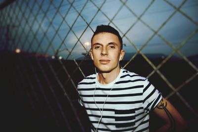 Portrait of young man standing outdoors