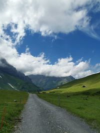 Road amidst landscape against sky