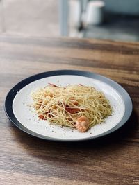 High angle view of rice in plate on table