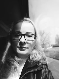 Close-up portrait of beautiful woman wearing eyeglasses