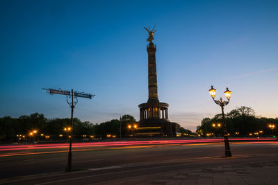 Light trails on street at dusk