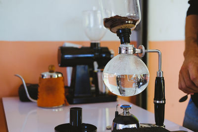 Close-up of pouring coffee in glass