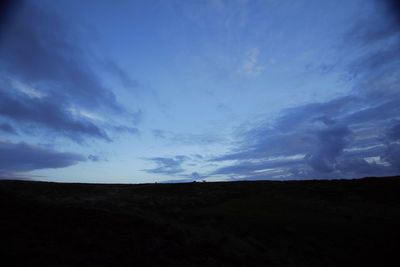 Silhouette landscape against sky