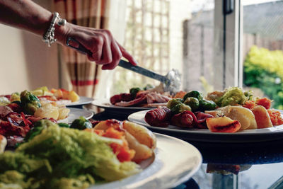 Midsection of woman serving food