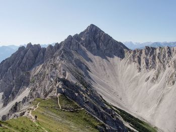 Scenic view of mountain ridge against clear sky.