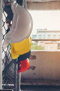 Close-up of yellow umbrella in city